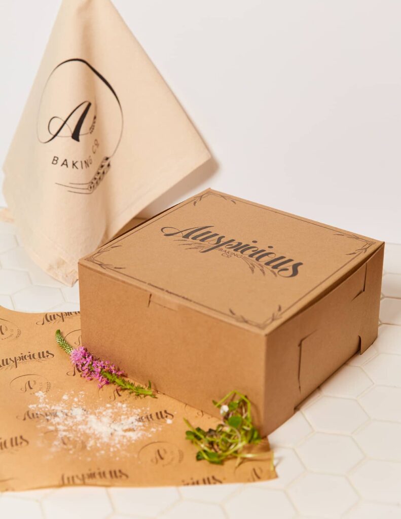 Custom box design & deli paper created for Auspicious Baking Co by Olive Ridley Studios