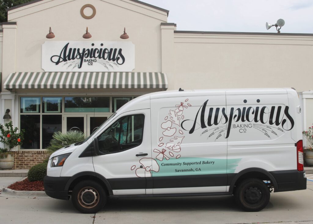 Custom van wrap (partial) created for Auspicious Baking Co by Olive Ridley Studios - side view