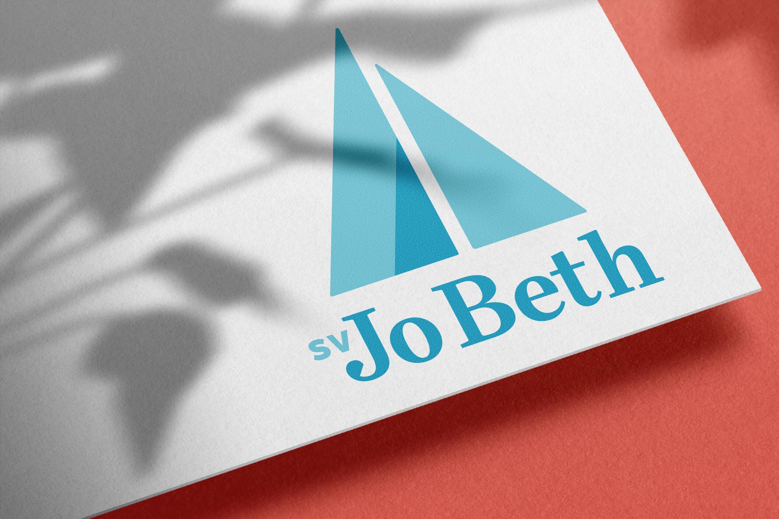 Visual brand identity design for SV Jo Beth by Olive Ridley Studios: mockup of the logo printed on a card