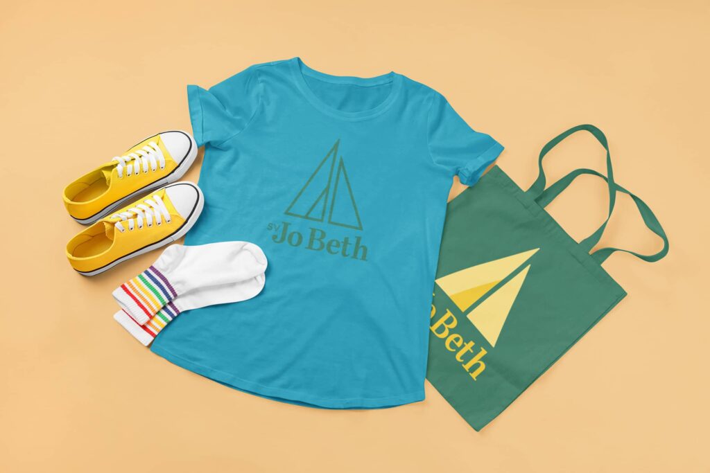 Visual brand identity design for SV Jo Beth by Olive Ridley Studios: a t-shirt and tote bag mockup