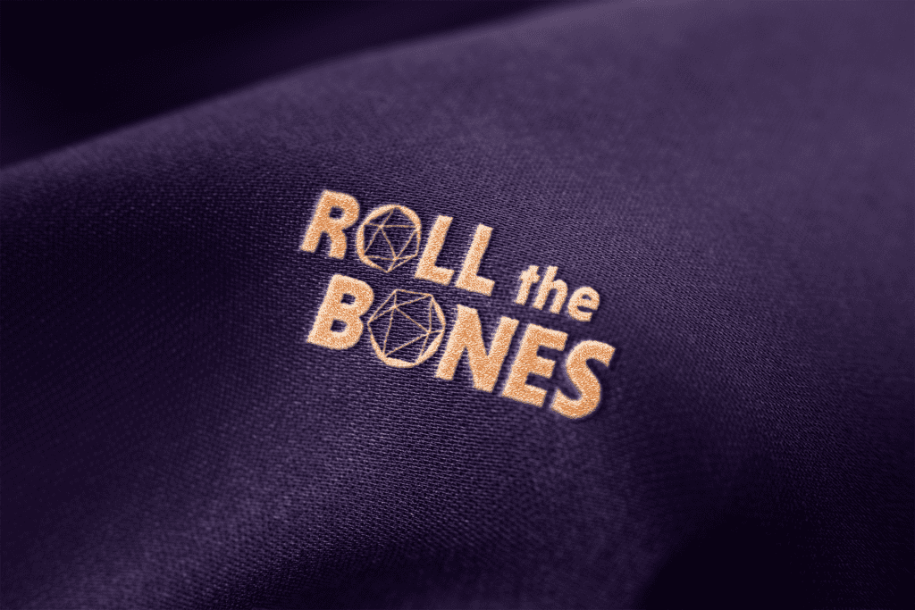 Visual brand identity design created for Roll The Bones by Olive Ridley Studios - Logo mocked up as an embroidered graphic